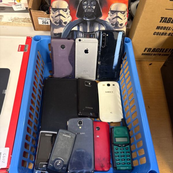 Mixed lot of used mobile phones including iPhone and Samsung devices.