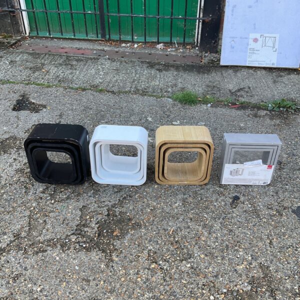 Set of four modern cube shelves needing restoration.