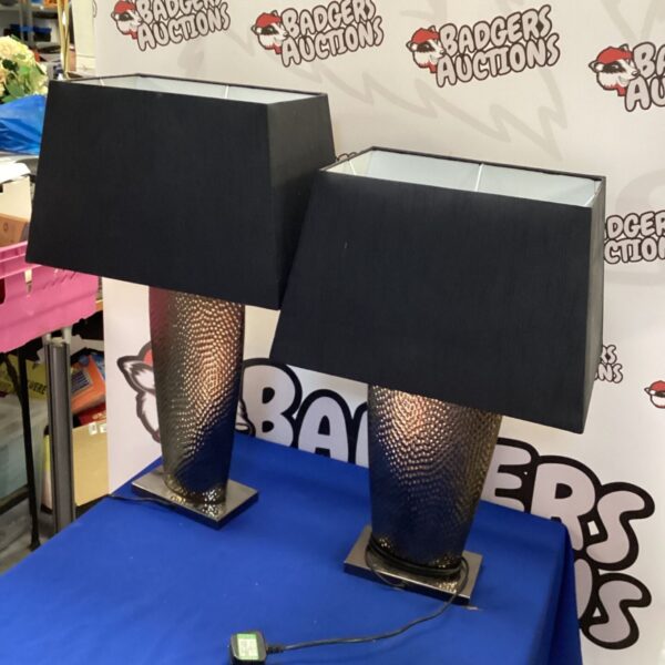 Pair of modern black table lamps with textured bases.