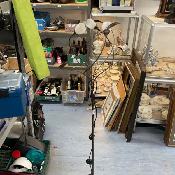 Black metal modernist standard lamp with adjustable shades.