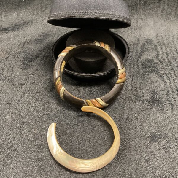 Vintage mother of pearl cuff bracelet with horn and metal inlay.