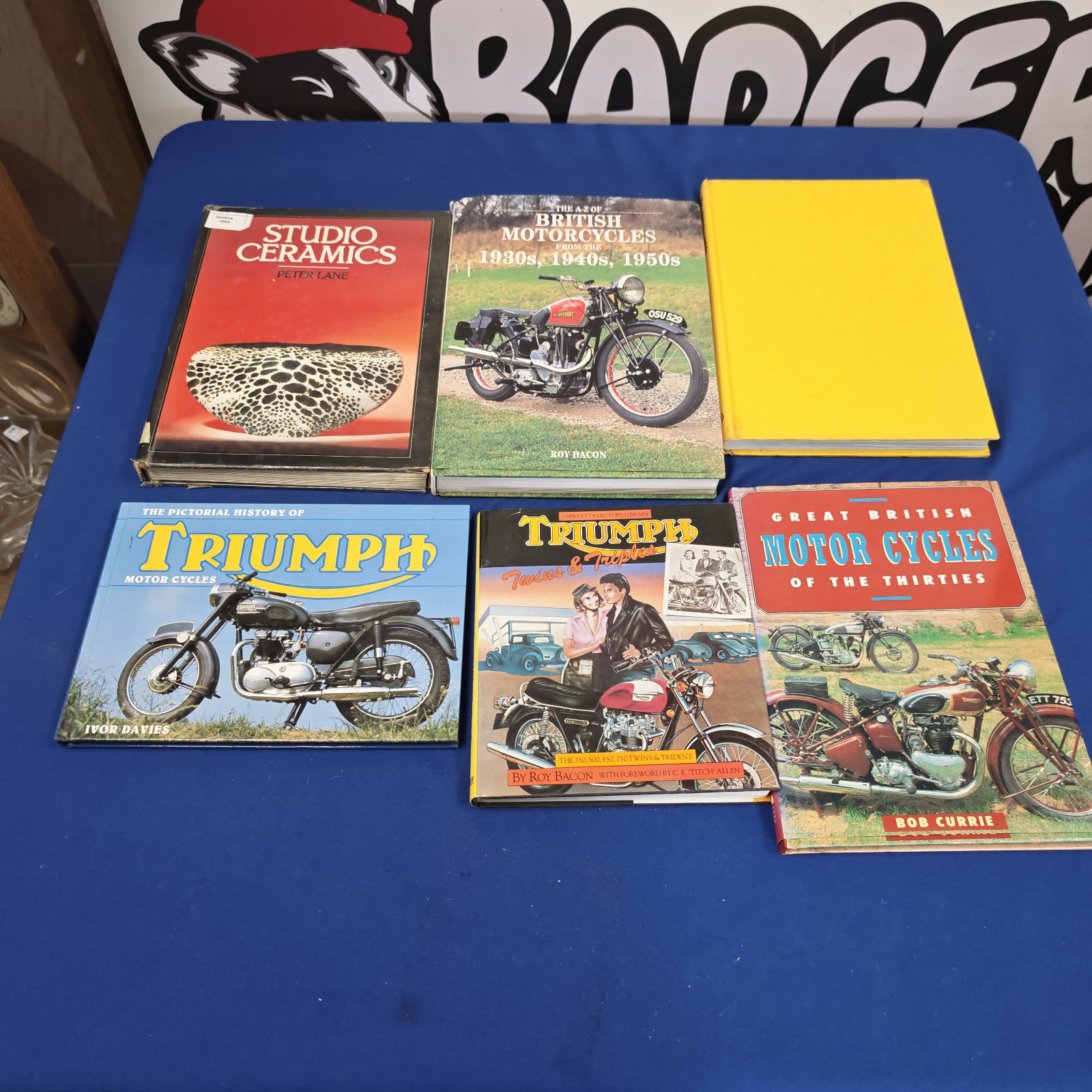 Vintage motorcycle books including Triumph and Guinness guide.