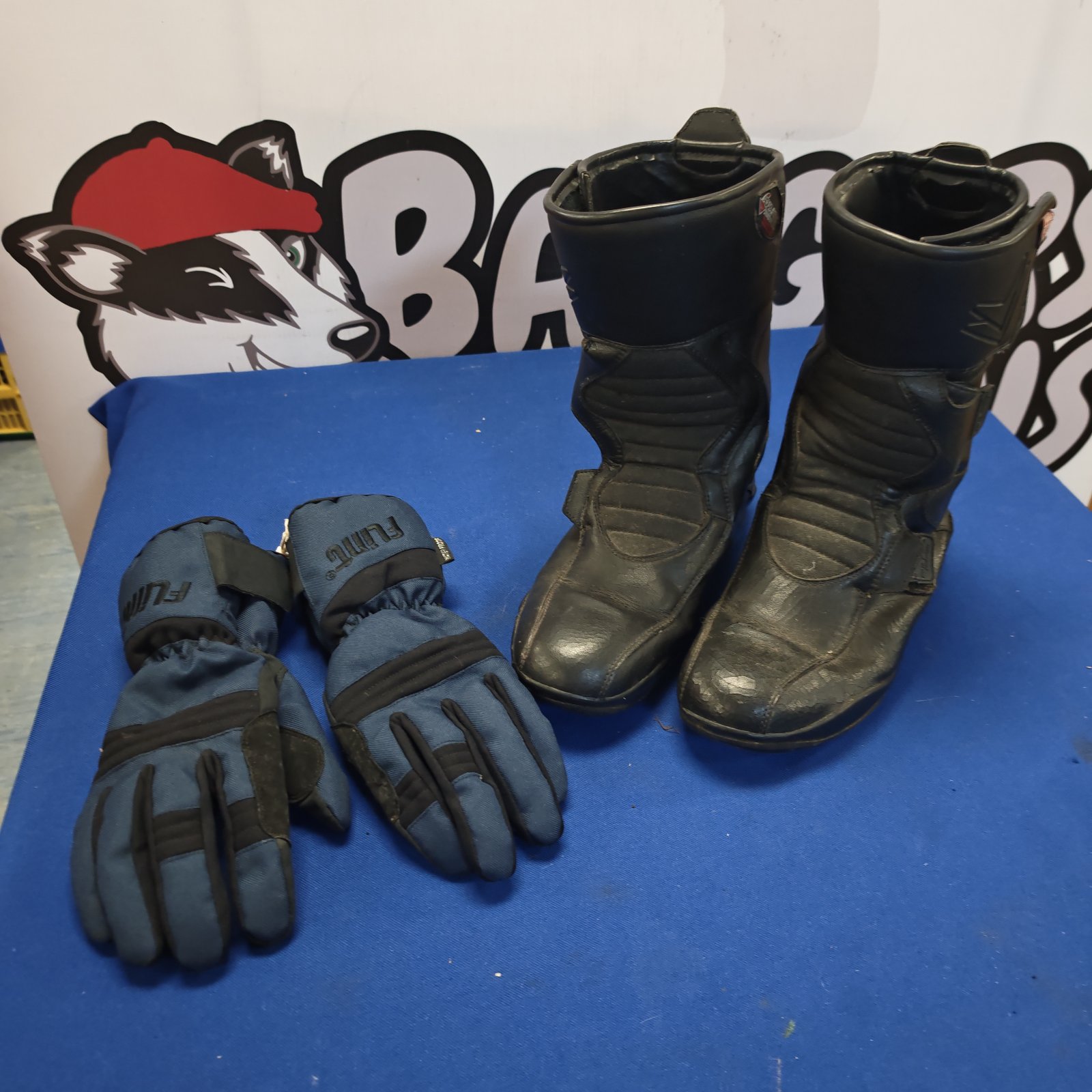 Motorcycle gloves and black leather boots for riding.