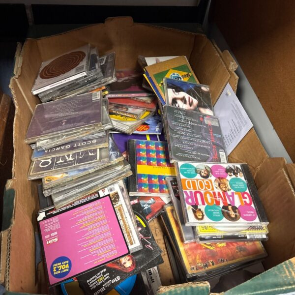 Mixed lot of music CDs with various artists and album covers.