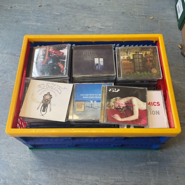 Music CD collection including Pulp, Eagles and Pogues CDs in a blue box.