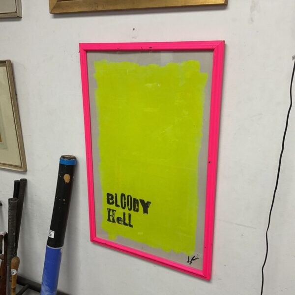 Vibrant neon artwork titled "bloody hell" in a black frame.