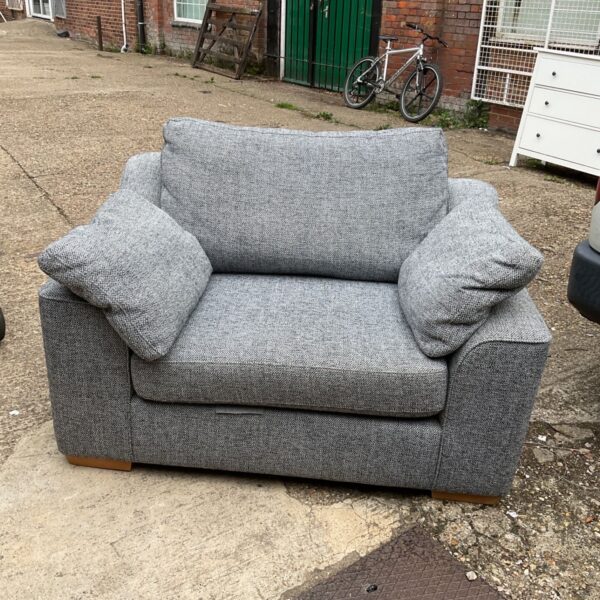 Large grey Next snuggle chair with comfortable cushioning.
