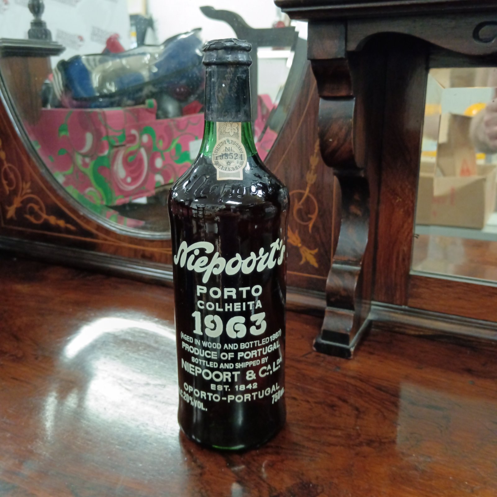Sealed bottle of 1963 Niepoort Colheita Port wine.