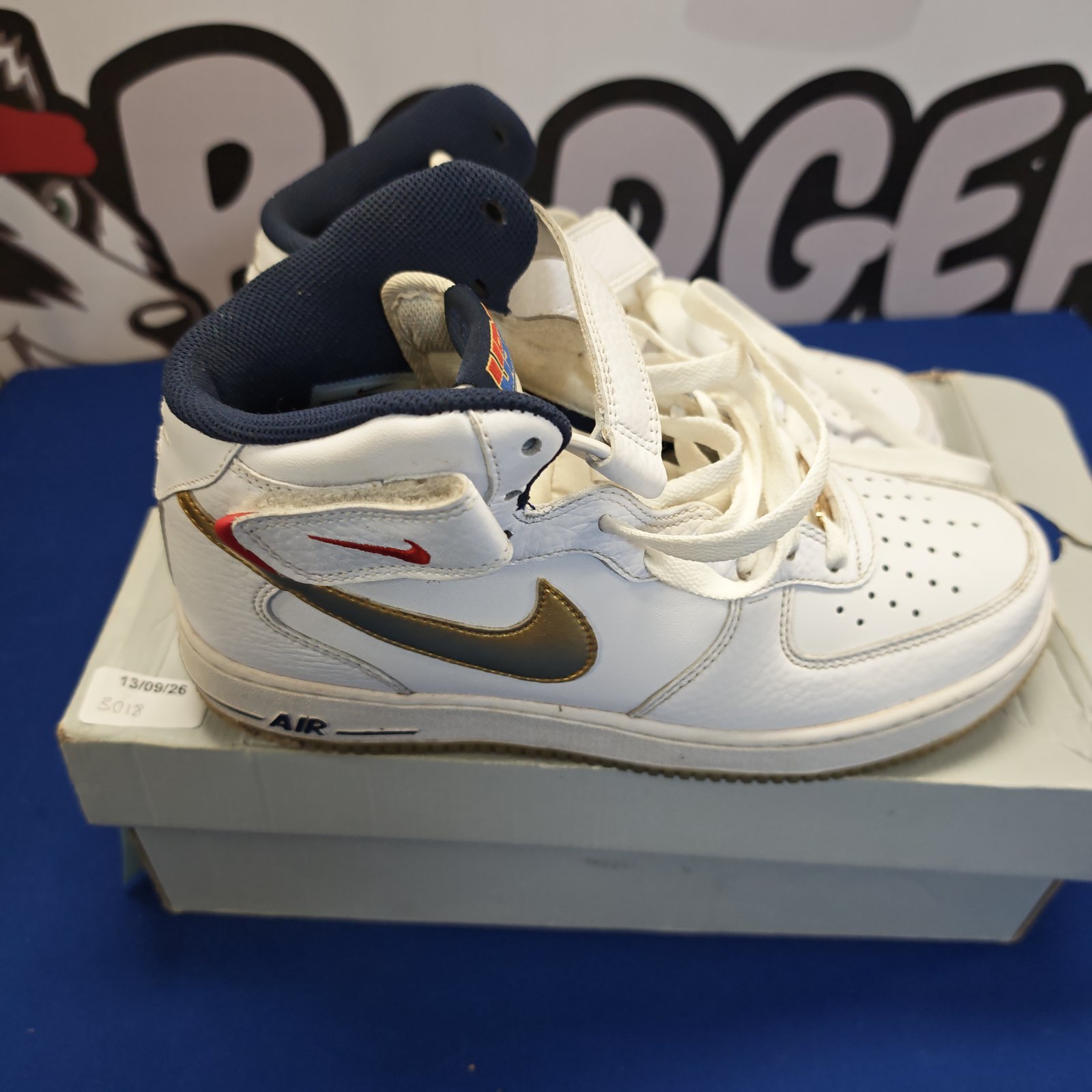 White and black Nike Air Hi-top trainers size 7.