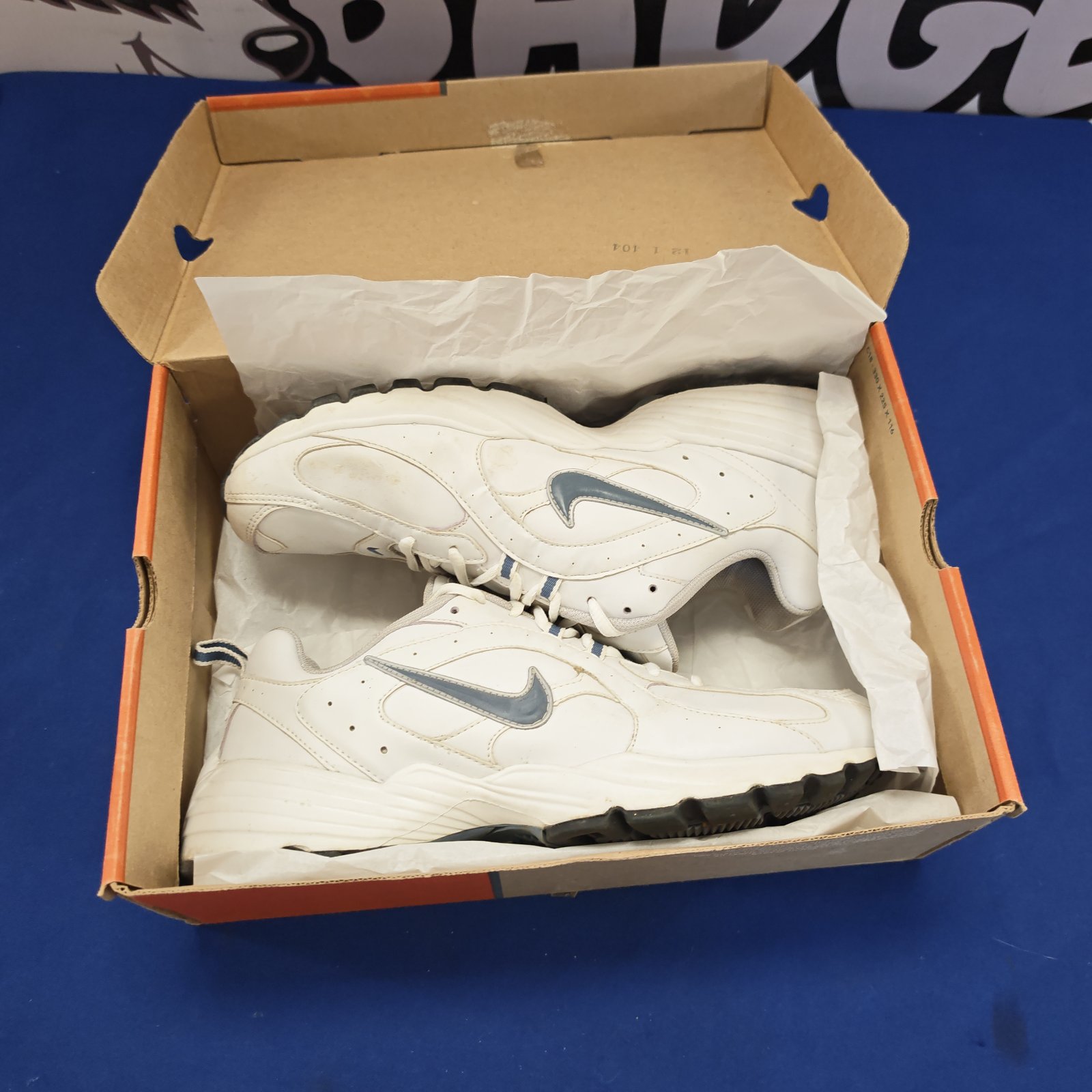 White and grey Nike trainers size 10 in original box.