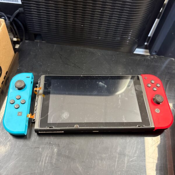 Damaged Nintendo Switch console for repair or parts.