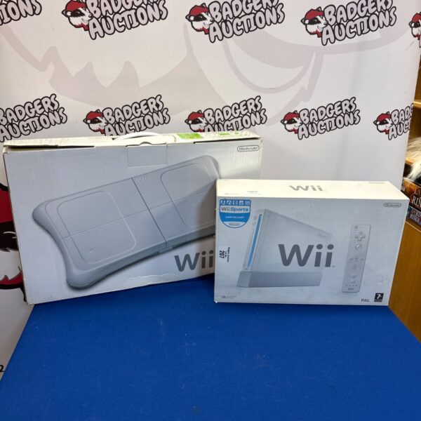 Nintendo Wii console with boxed Wii Fit board for gaming and fitness.