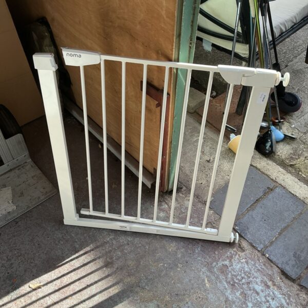 White Noma stairgate for child and pet safety.