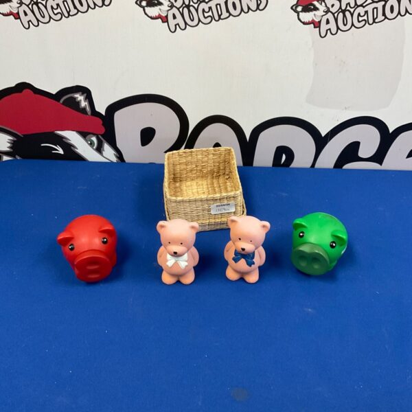 Close-up of novelty teddy bear and pig ornaments for collectors.