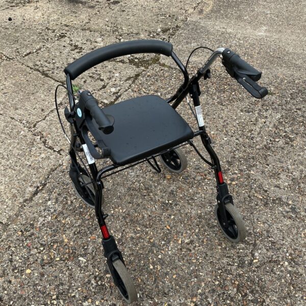 NRS Healthcare wheelchair with a padded seat and folding frame.