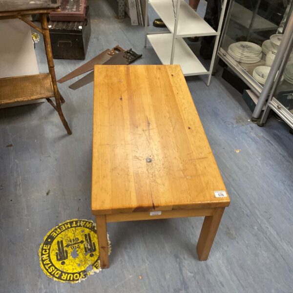 Rustic oak coffee table with a warm wood finish.
