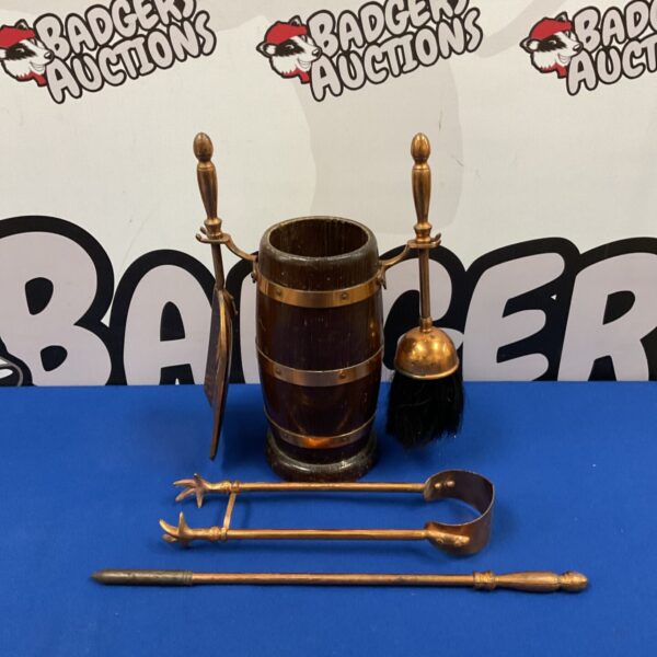 Vintage fireplace companion set with oak barrel and copper tools.