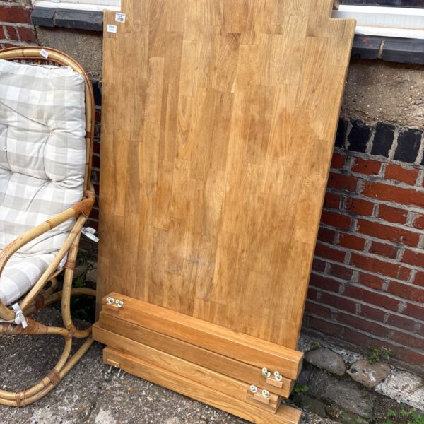 Large oak kitchen table with detachable legs, ideal for farmhouse dining.