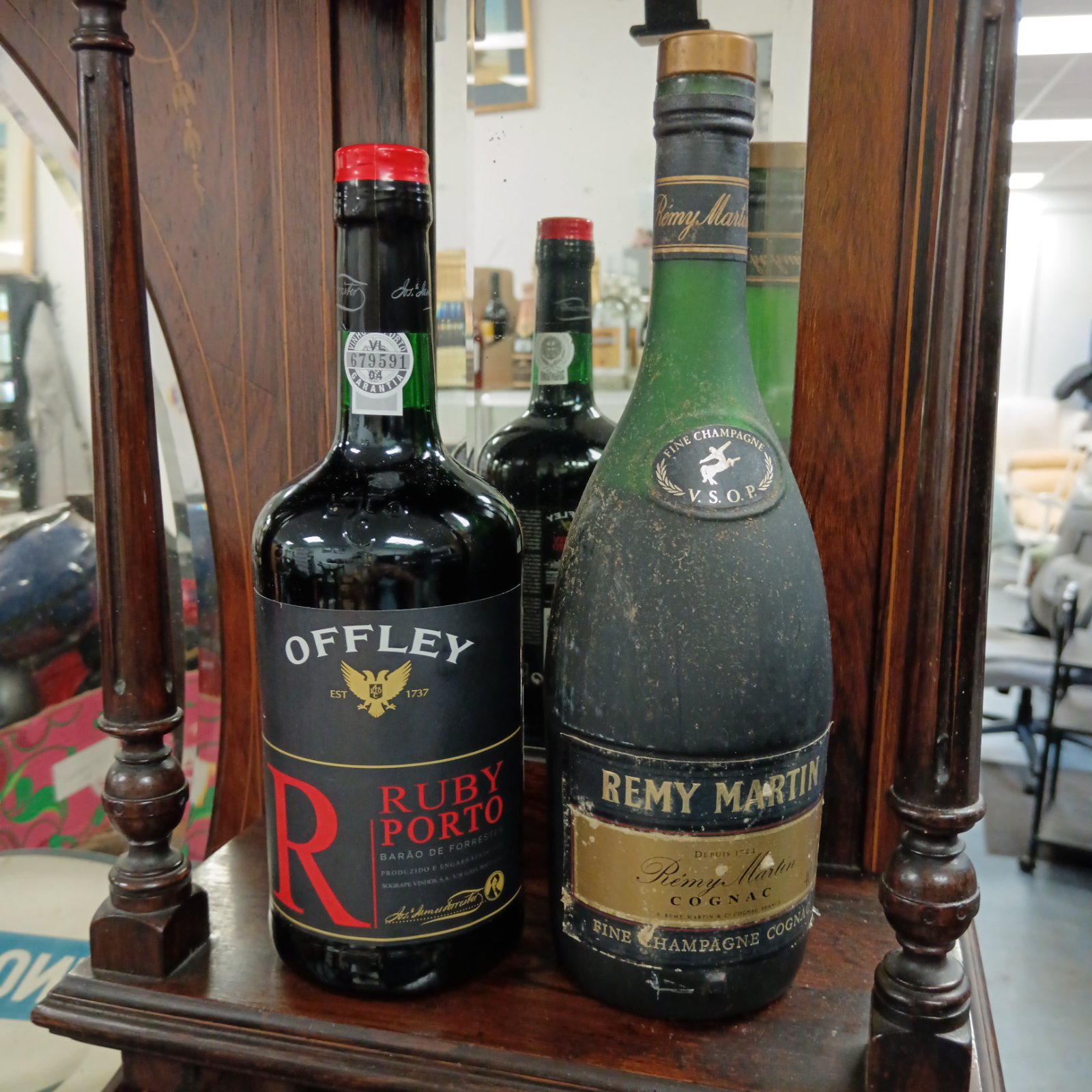 Sealed bottles of Offley Ruby Port and Remy Martin Cognac for collectors.