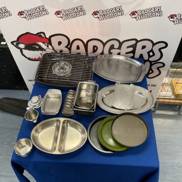 Lot of vintage metal oven and serving trays for kitchen use.