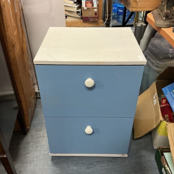Pale blue two-drawer bedside table with wooden knobs.