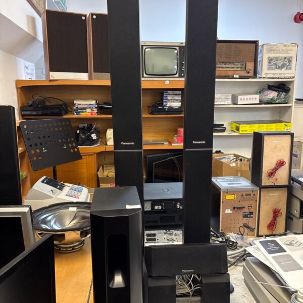 Panasonic home theater speaker system with tower speaker visible.