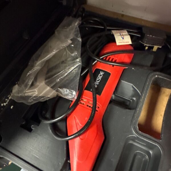 Red Parkside electric chisel with damaged packaging.