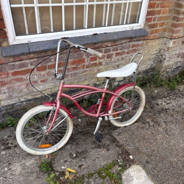 Pink Pegas childs lowrider bicycle with white wall tyres.