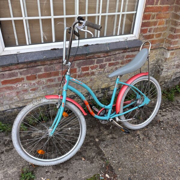 Vintage Pegas Strada 2 bicycle with a blue frame and single-speed drivetrain.