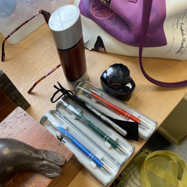 Vintage pen sets and a bottle of Parker ink for collectors.