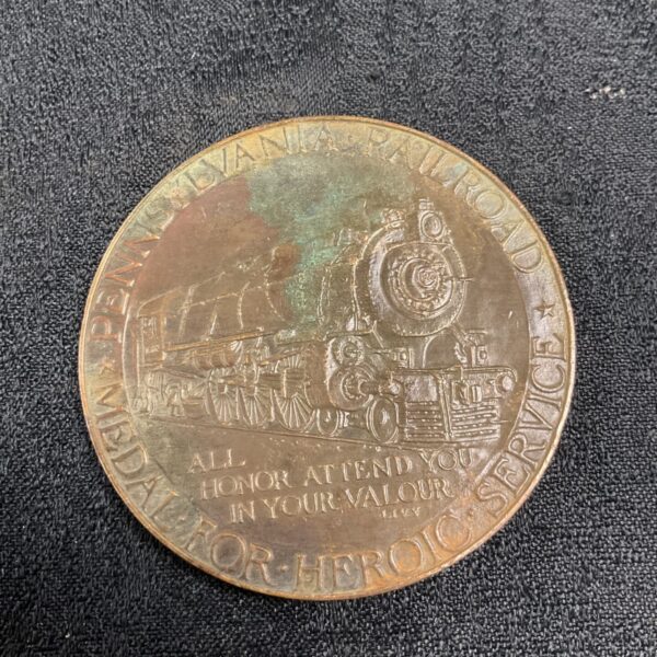 Pennsylvania Railroad Heroic Service Medal with steam locomotive design.