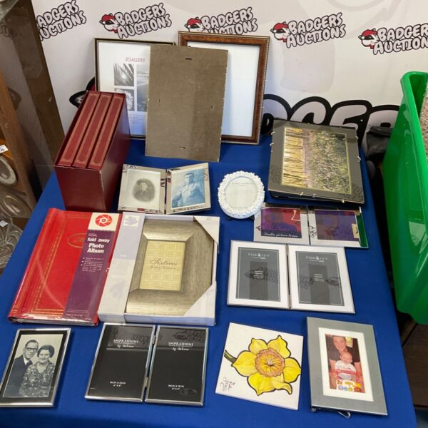 Quantity of new photo frames in various sizes and colours.