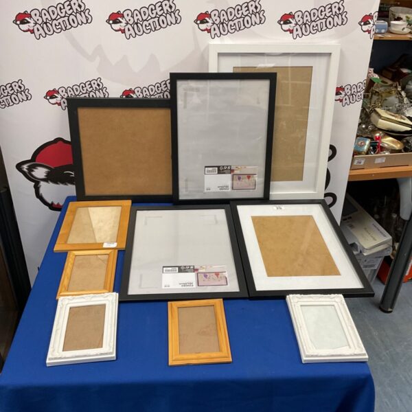 Assorted new picture frames in various colours and sizes.