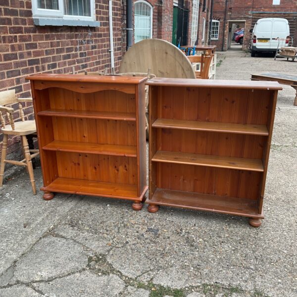 Pair of vintage pine bookcases with adjustable shelves.