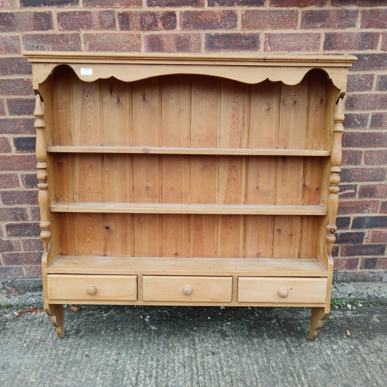 Vintage pine plate display unit with drawers for collectors.