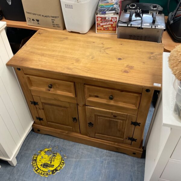Vintage pine sideboard with two doors and a drawer.