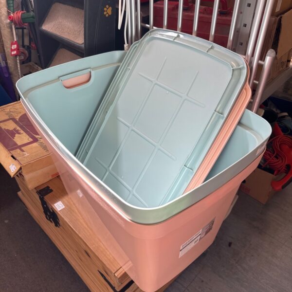 Pale pink Ezystorage storage boxes with lids for household organisation.