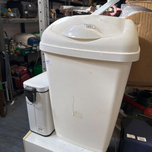 White plastic flip top bin with a smaller metal Addis pedal bin.