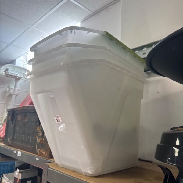 Clear plastic storage bin with lid for household organisation.