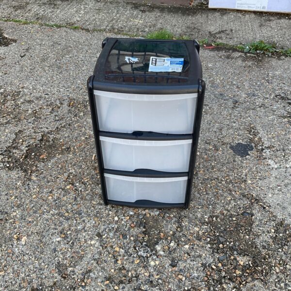Three drawer plastic storage unit for home organisation.