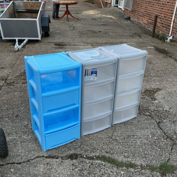 Lot of three plastic storage units with drawers.