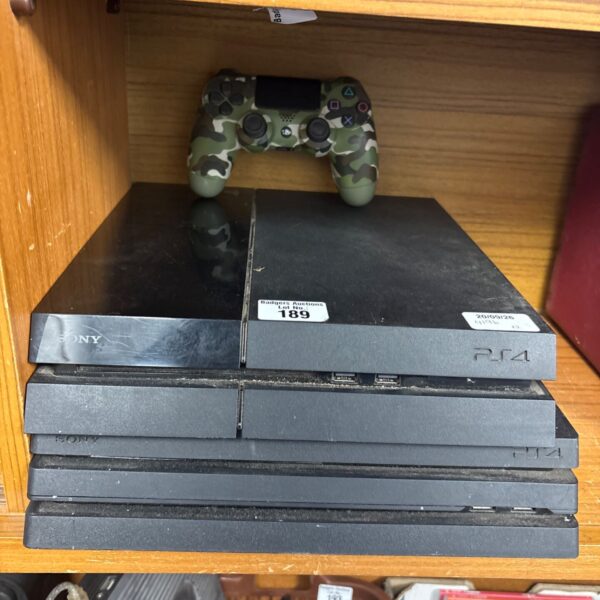 Two PlayStation 4 consoles, including a PS4 Pro, for auction.