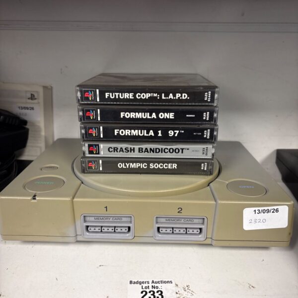 PlayStation One console with games, retro gaming system.