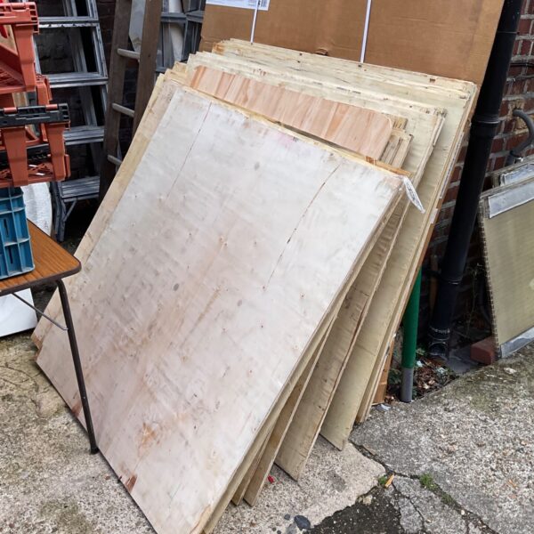 Stack of plywood sheets for DIY projects.