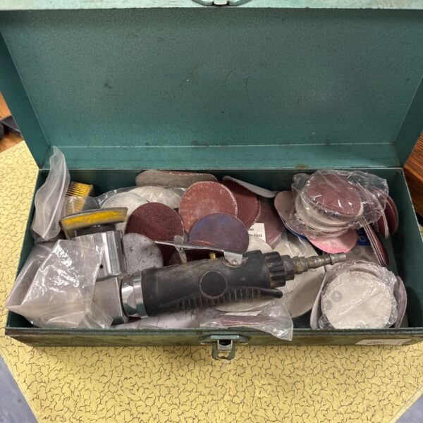 Pneumatic sander with assorted sanding pads for detail work.