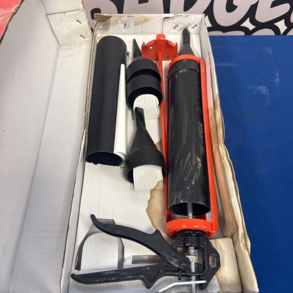 Vintage pointing and grouting gun set in original packaging.