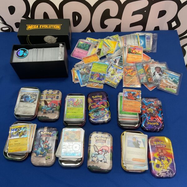 Large Pokemon card collection with tins, ideal for collectors.