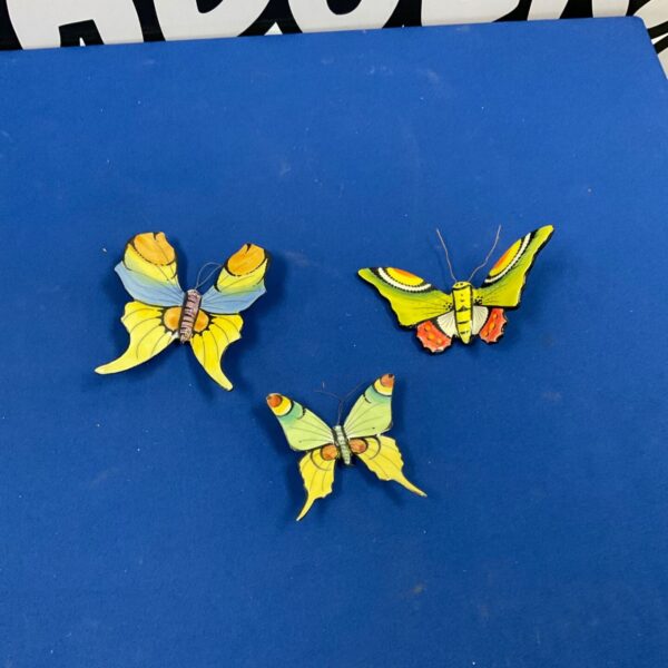 Hand-painted porcelain butterflies, a beautiful decorative set.
