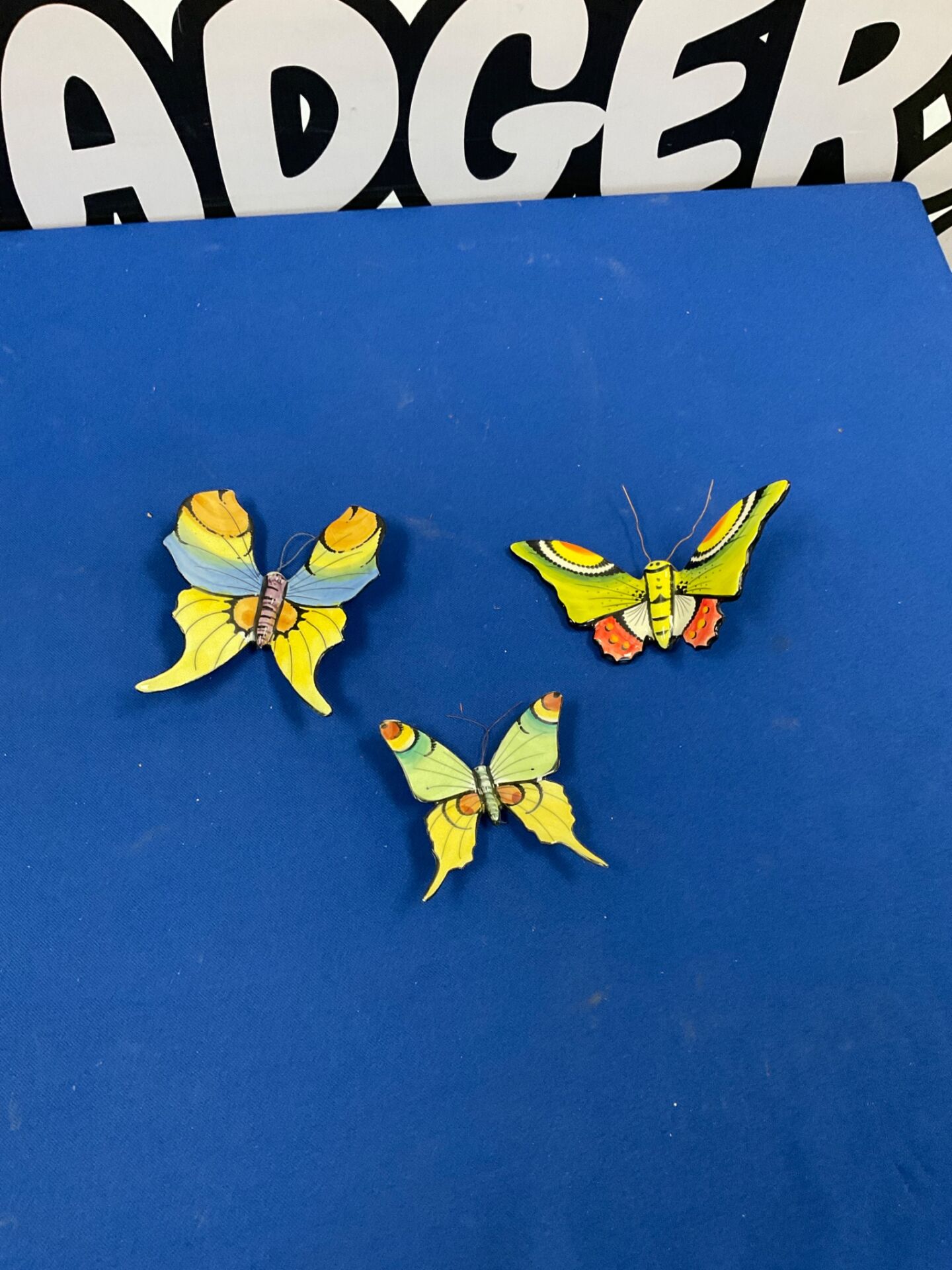 274 Three porcelain hand painted butterflies