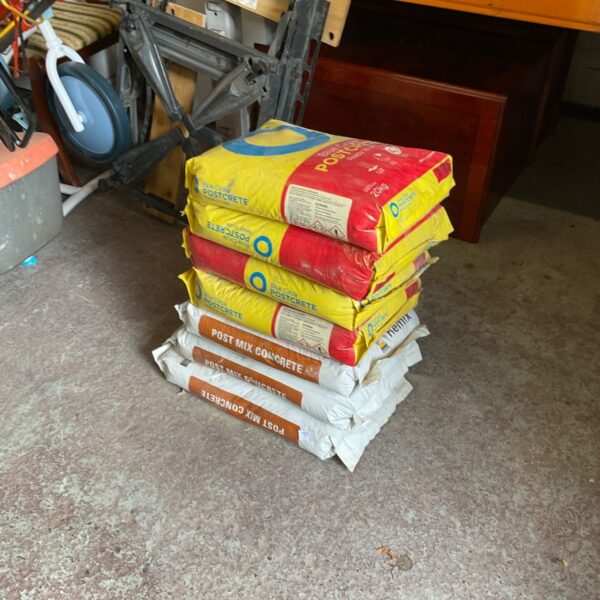 Six bags of unopened post mix concrete for garden and DIY projects.